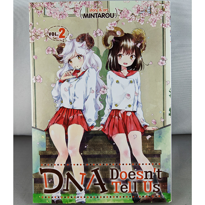 Front cover of DNA Doesn't Tell Us Volume 2. Manga by Mintarou