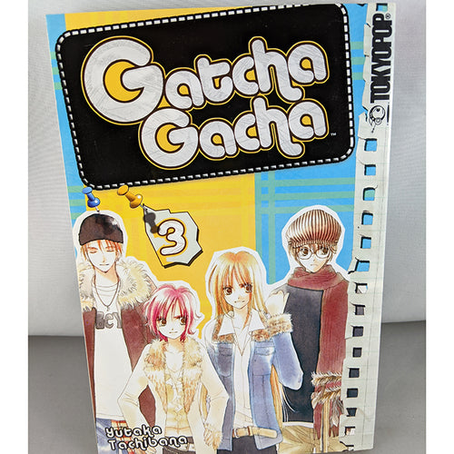 Front cover of Gatcha Gacha Volume 3. Manga by Yutaka Tachibana.